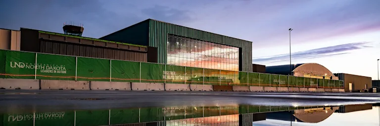 The new, under-construction, flight operations center at sunset