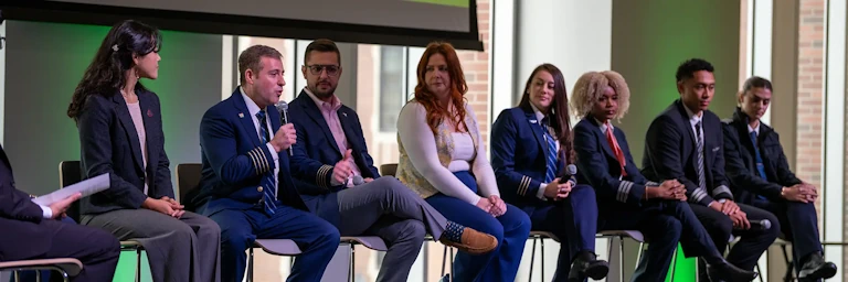 A panel at the Faces of the Industry event answers questions from an unseen audience