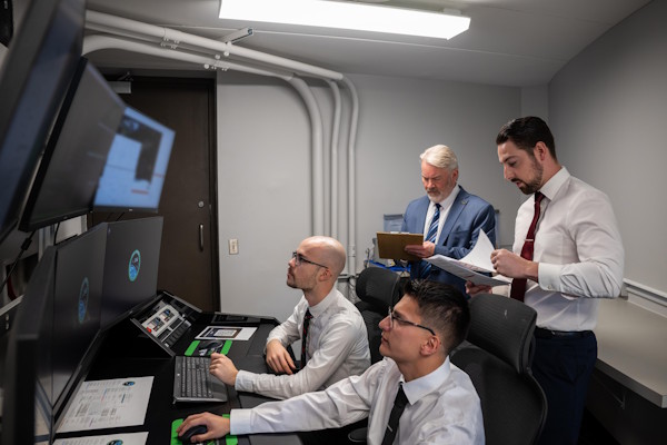 Members of the ROADS team monitor screens